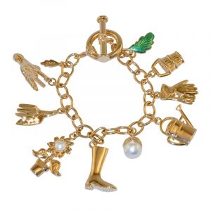 gold plated charm bracelet with charms of a green enamelled leaf, watering can, sunflower, flower pot, trowel, gloves, wellington boot, wheelbarrow and acorn.